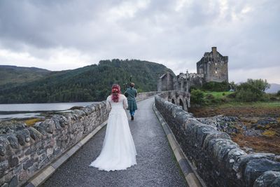 Rachel being piped across the Eilean Donan Castle bridge